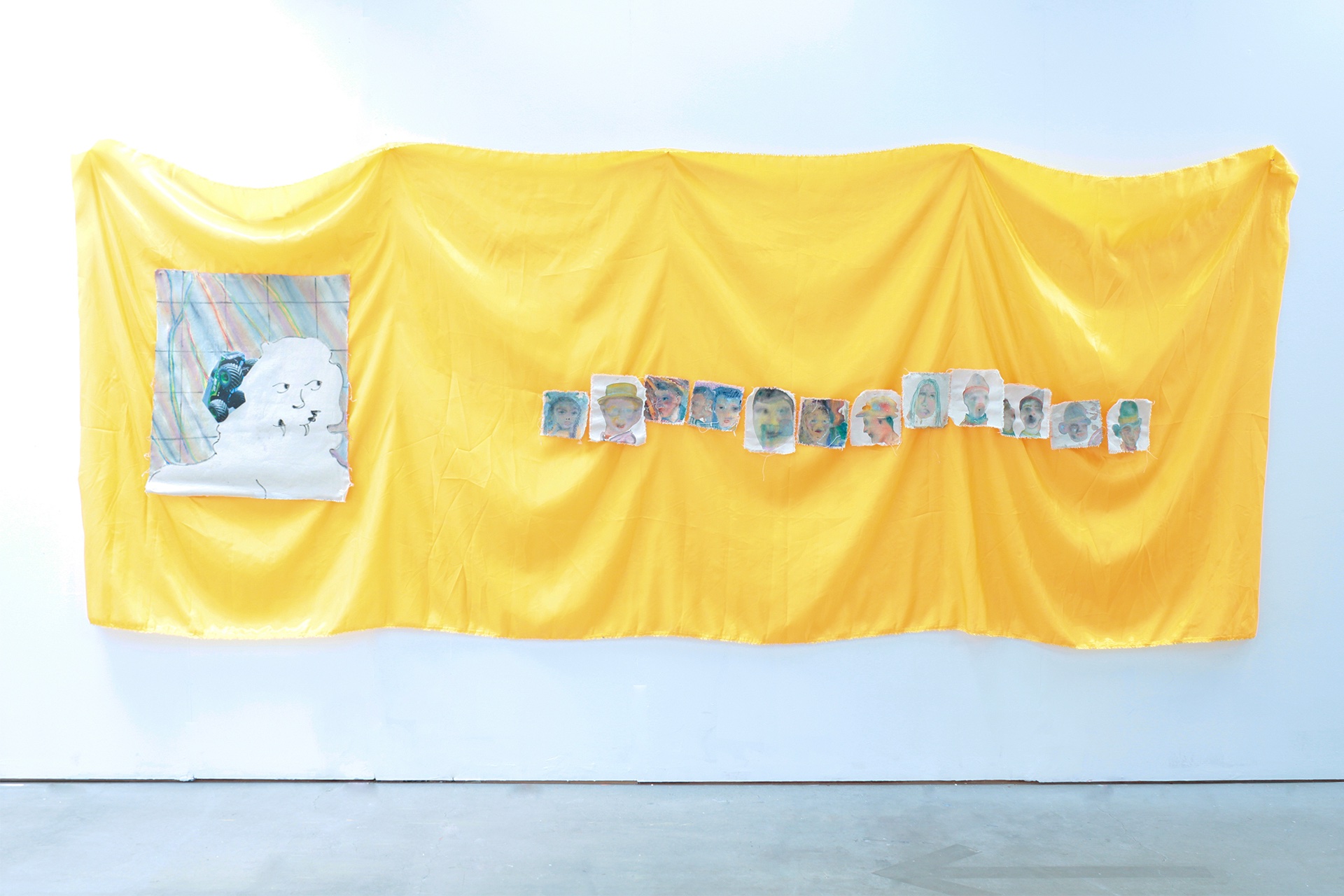 Multiple paintings on gold satin. The paintings depict a heraldic lion head and smaller portraits of lost peripheral souls of the carnival.